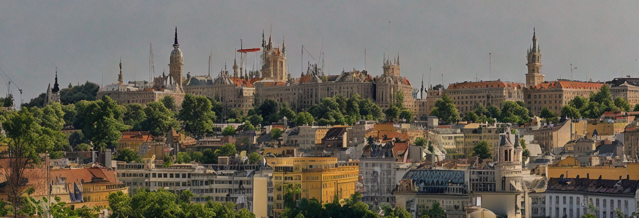 Historic cityscape with lush greenery and towers under clear sky