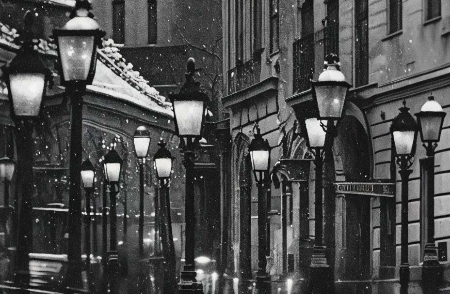 Snowy night scene on vintage street with lit lamps