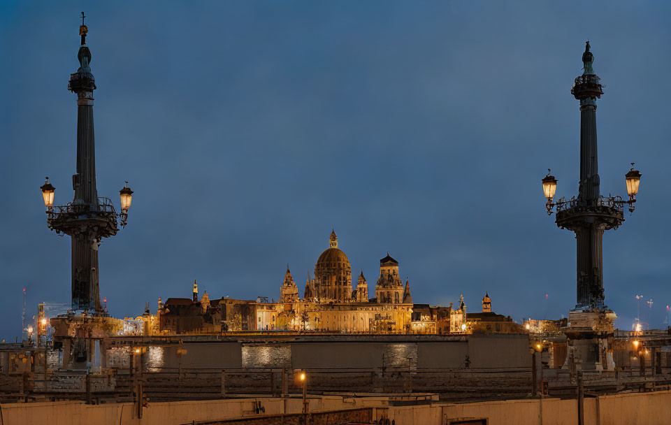 Ornate historical building with lit facade at twilight