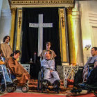 Historical scene reimagined with modern wheelchairs and ancient robes