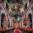 Ornate Baroque Church Interior with Red Carpet Aisle