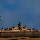 Ornate Bridge with Sculptures Overlooking Historical Dome