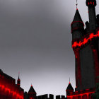 Fantasy landscape with towering castles and red glowing windows in misty ambiance