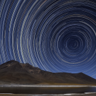 Night Sky Time-Lapse: Circular Star Trails & Forest Silhouette