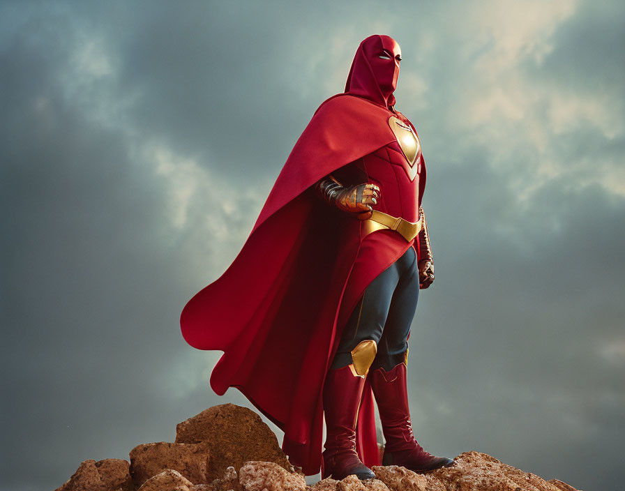 Superhero in red and gold costume on rocky terrain under dramatic sky