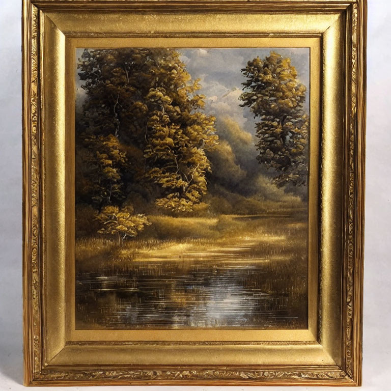 Framed landscape painting of serene forest with reflective water