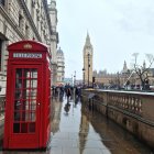 Traditional Old City Street Scene with Red Telephone Booth and People