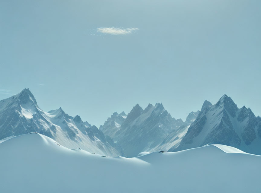 Snow-Covered Peaks Under Clear Blue Sky with Solitary Cloud