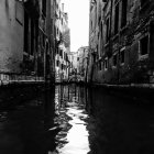 Monochrome watercolor painting of Venetian canal reflections