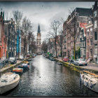 Canal in Amsterdam with Colorful Houses, Boats, and Church Tower