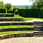 Ancient ruins with stone steps and circular archway in sunlit setting