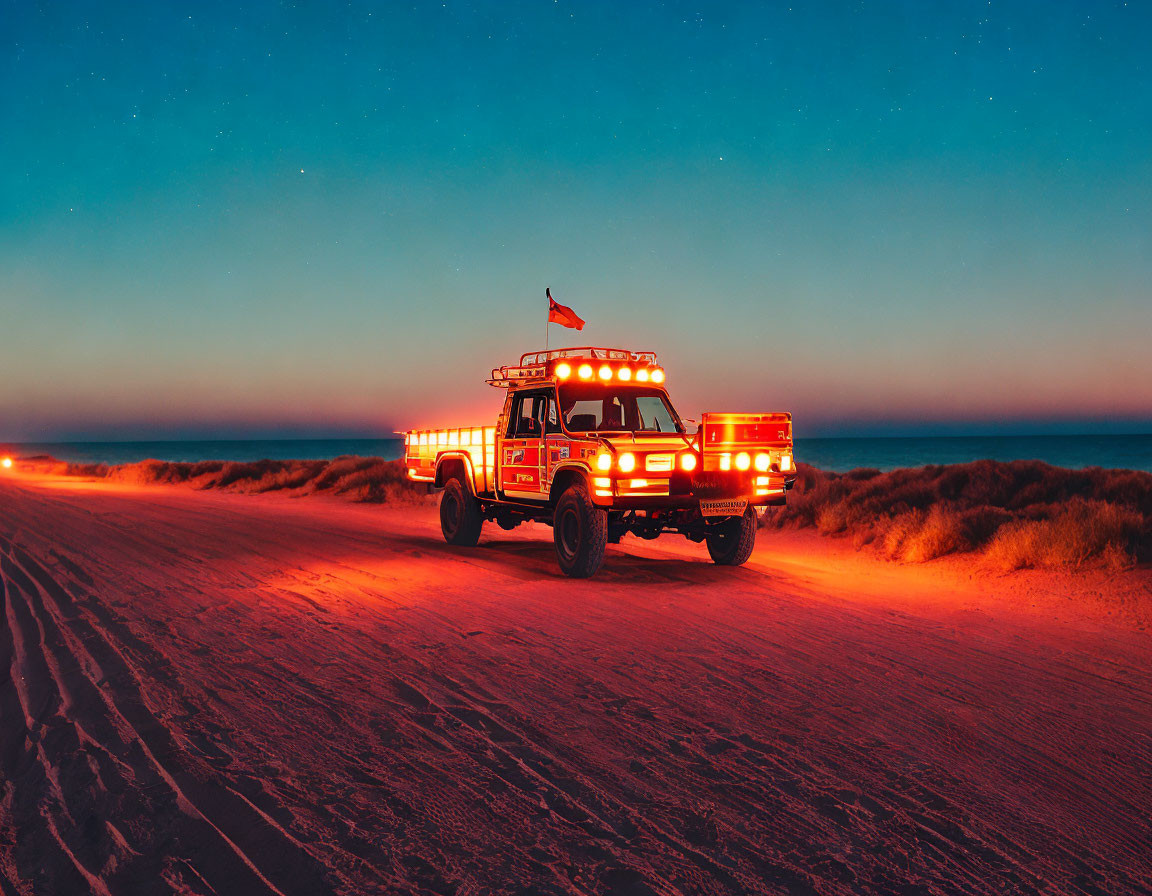 Vintage Fire Truck on Beach at Twilight with Flag and Starry Sky