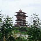 Traditional multi-tiered pagoda in snow-covered landscape