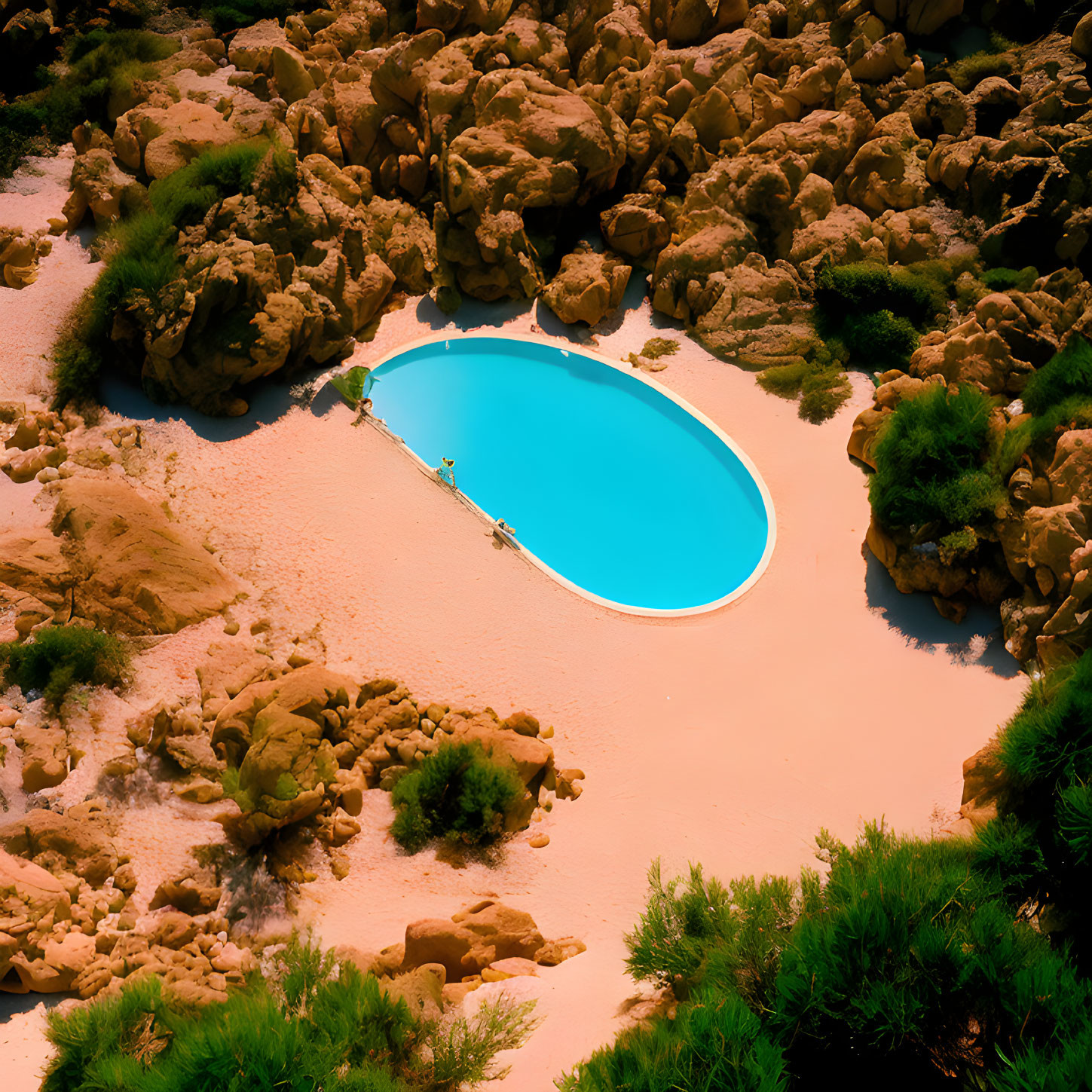 Scenic swimming pool in rocky oasis with greenery under sunny sky