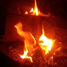 Volcanic cavern with flowing lava and flames in bright glow