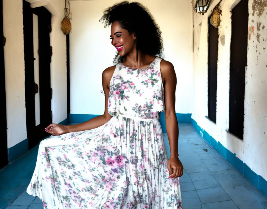 Smiling woman in floral dress in rustic corridor with lanterns