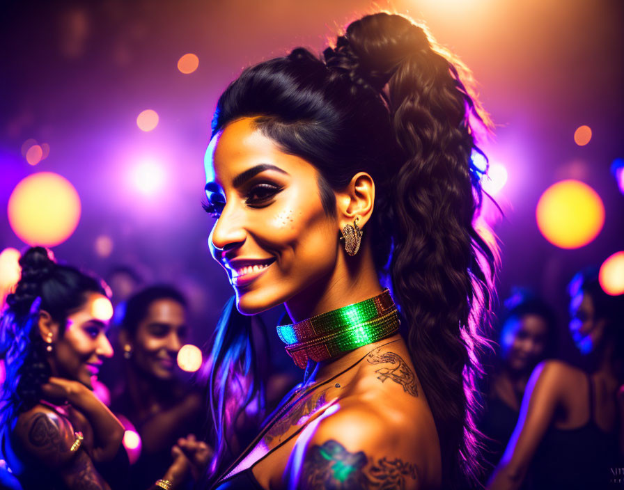 Tattooed woman with choker smiling at party with colorful lights