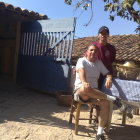 White horse, dog, and pack horse on cliff path overlooking gorge