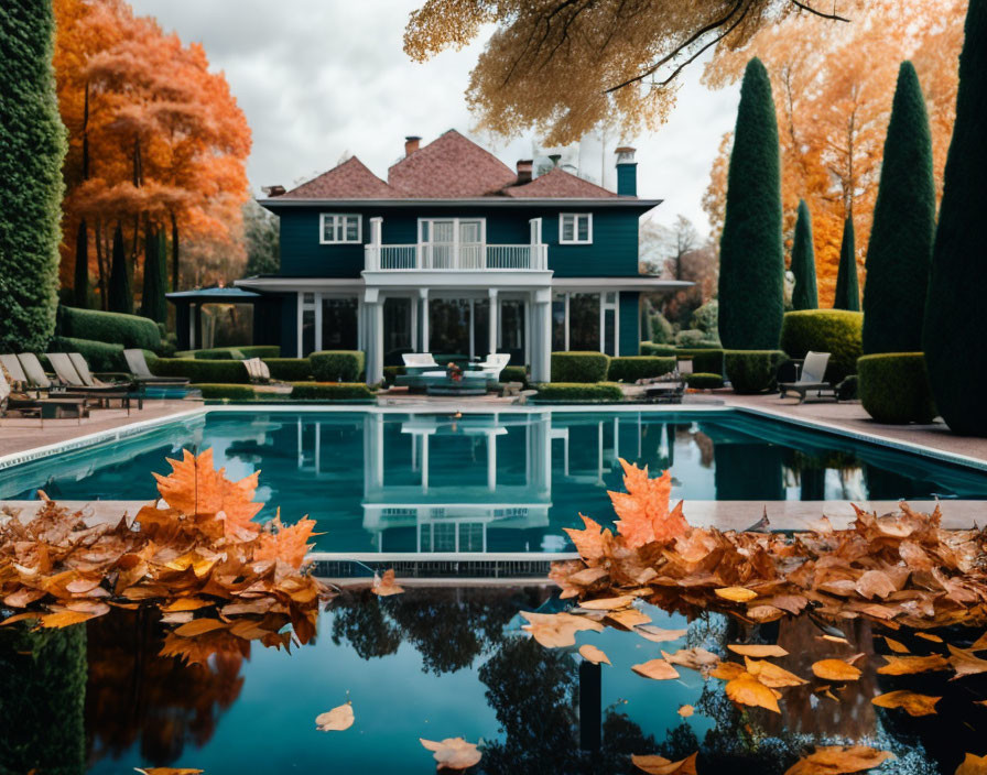 Luxurious Blue Facade House with Pool and Autumn Setting