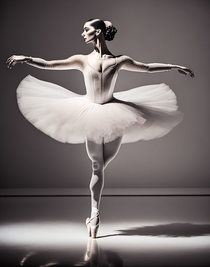 Poised ballerina in white tutu en pointe under spotlight