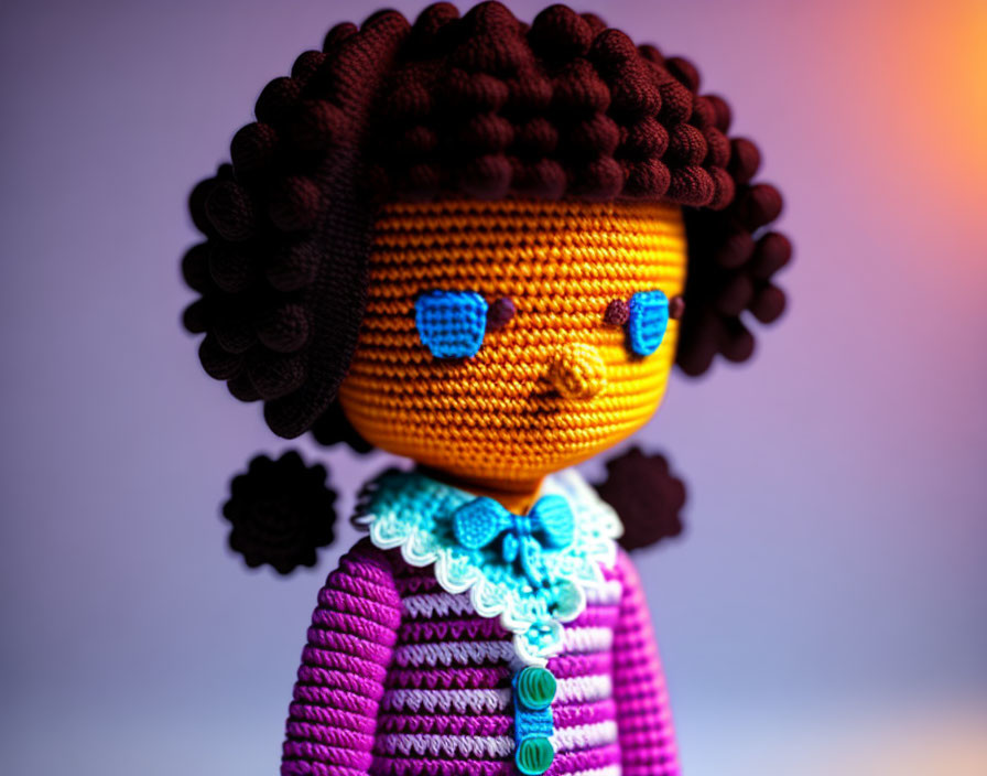 Intricately detailed crochet doll in purple dress, blue eyes, and curly hair on soft background
