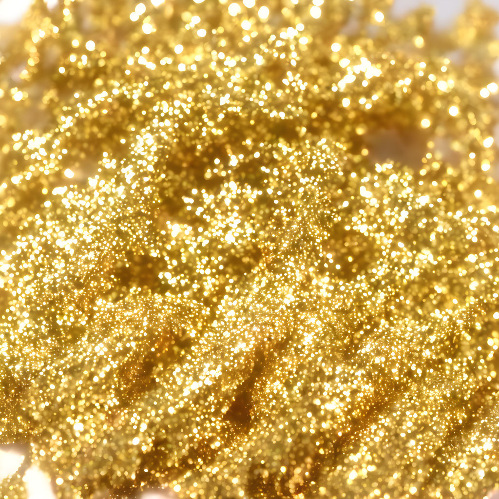 Shiny gold glitter close-up on soft focus background