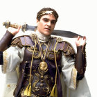 Warrior in ornate armor with fur cloak and sword pose