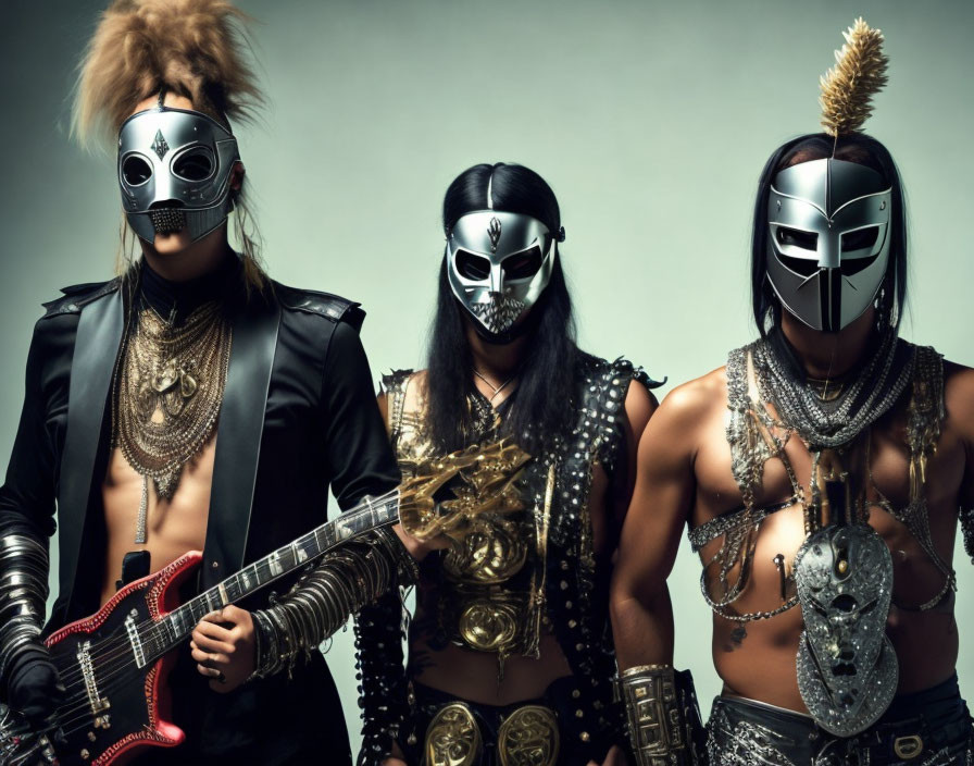 Three individuals in metallic masks and warrior attire with musical instruments on grey background.