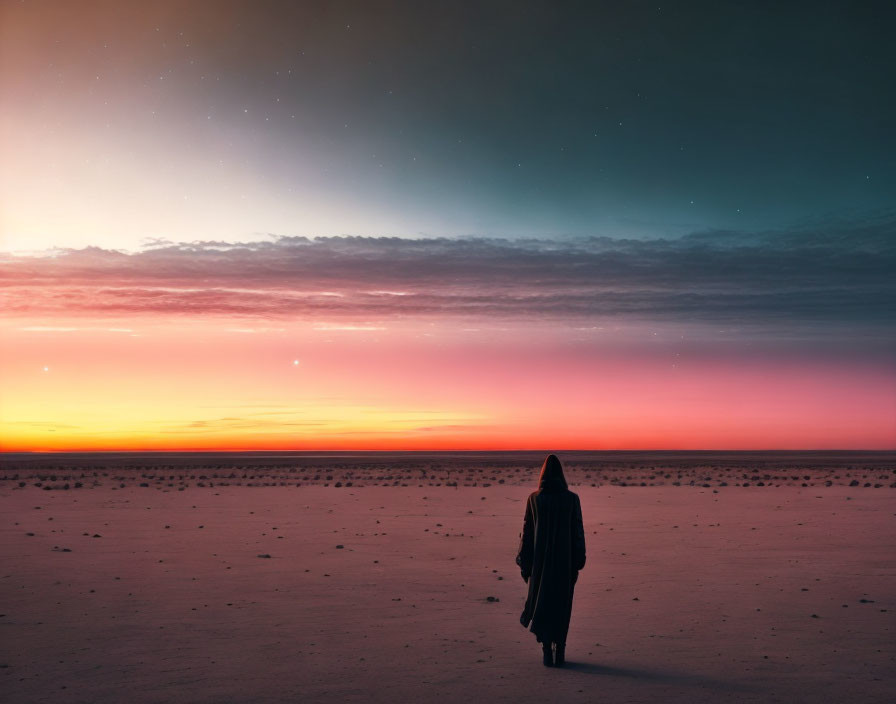 Lonely figure under gradient desert sunset sky