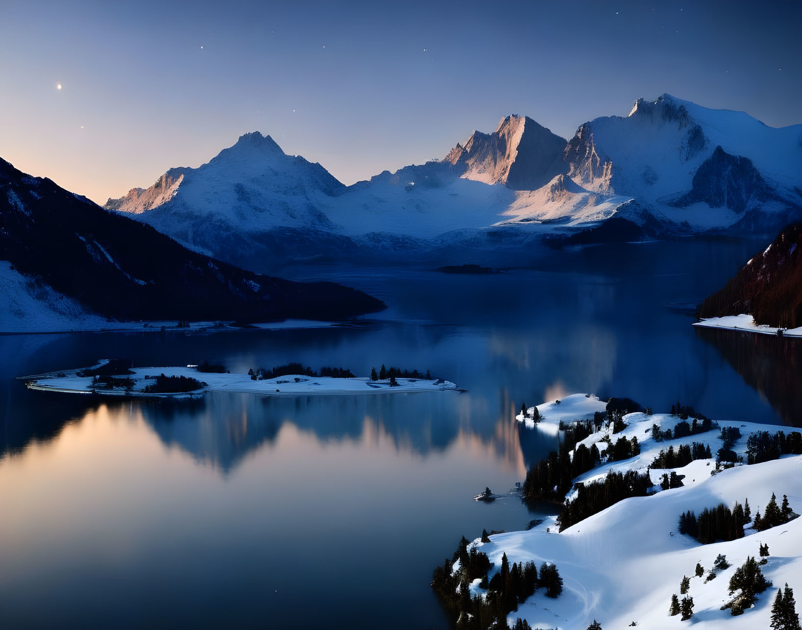 Snow-covered landscape with serene twilight, reflecting lake, mountain peaks, and star-filled sky.