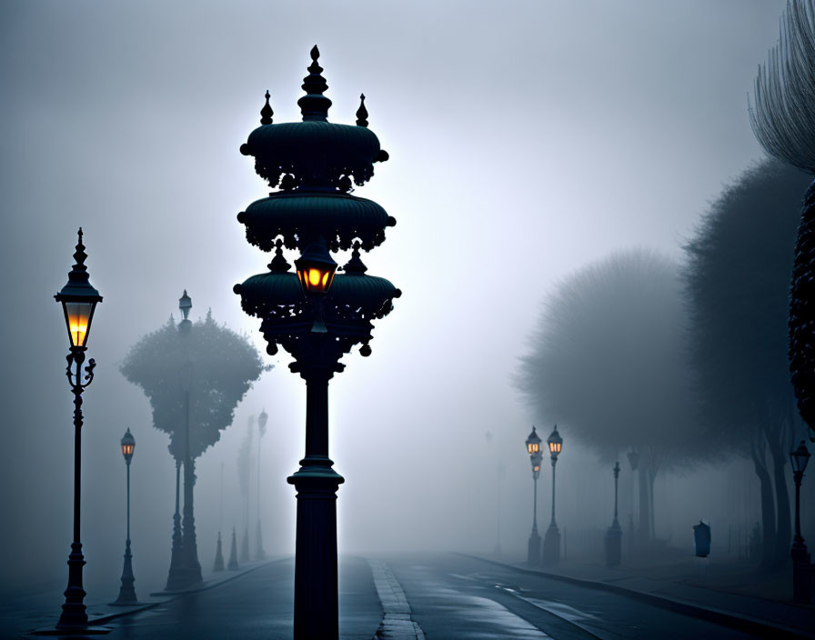 Misty street with glowing lampposts at dusk or dawn