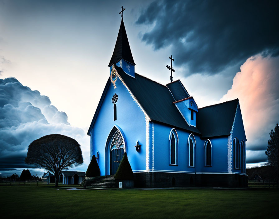 Blue Church with Pointed Steeple Against Dramatic Twilight Sky