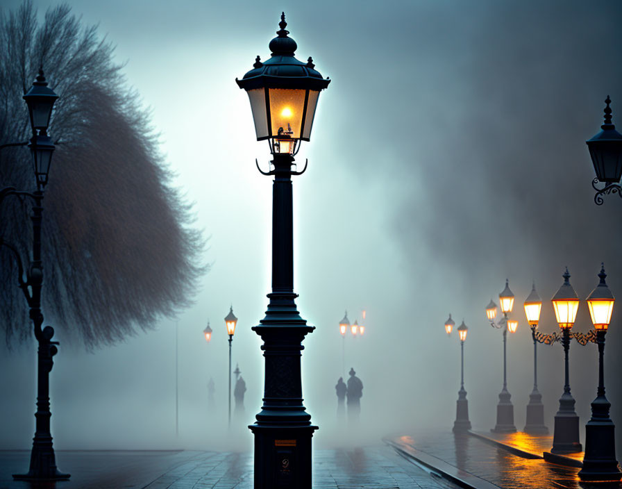 Ornate street lamps illuminate foggy twilight scene