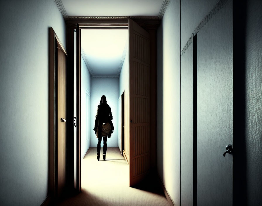 Dark hallway with figure facing bright room and doors