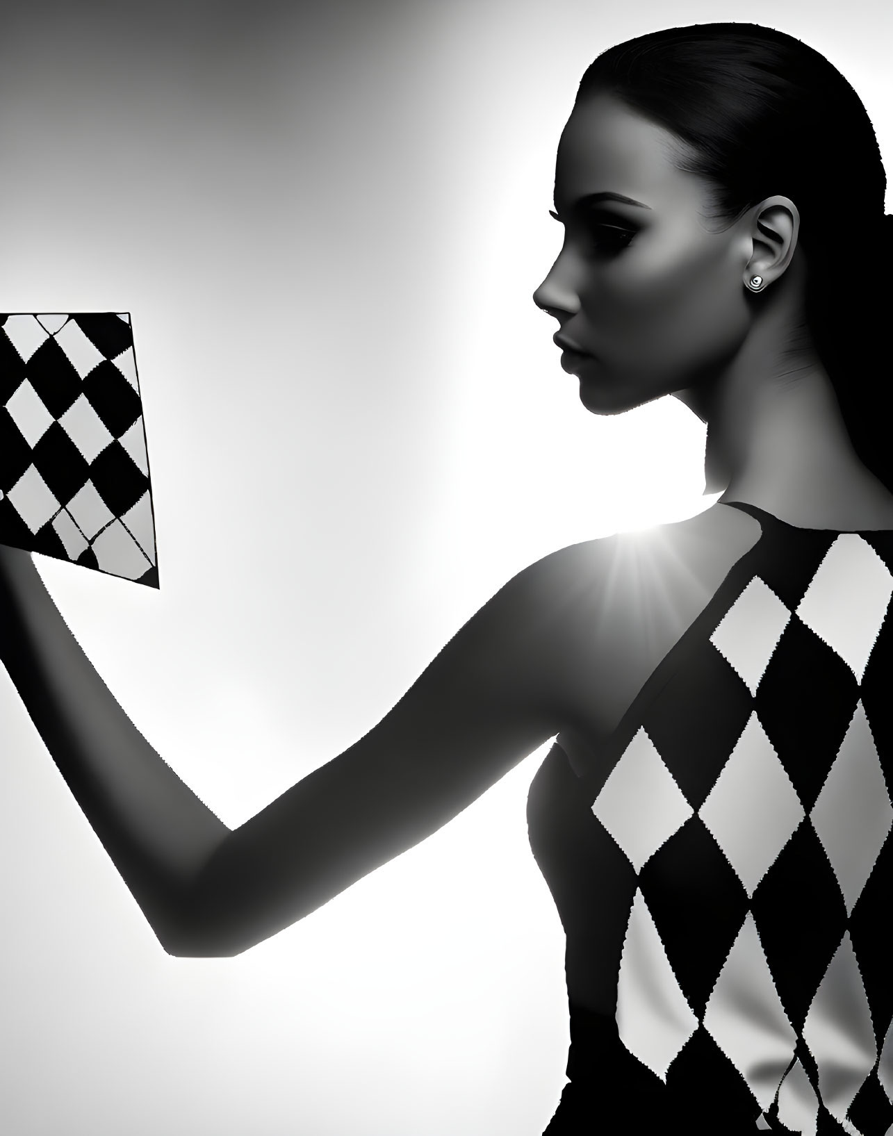 Monochrome image of woman in checkered outfit with patterned card