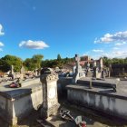 Tranquil cemetery scene with tombstones, monuments, and greenery