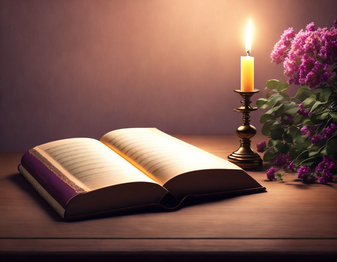 Open book on wooden table with lit candle and purple flowers bouquet