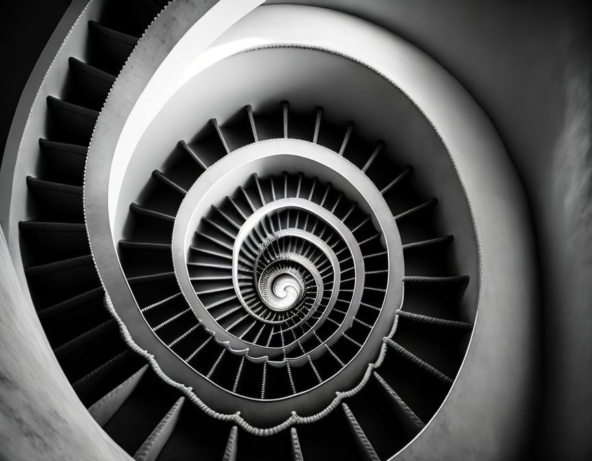 Monochrome spiral staircase with optical illusion of infinite depth