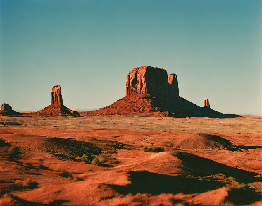 Tranquil desert landscape with red sandstone buttes at dusk