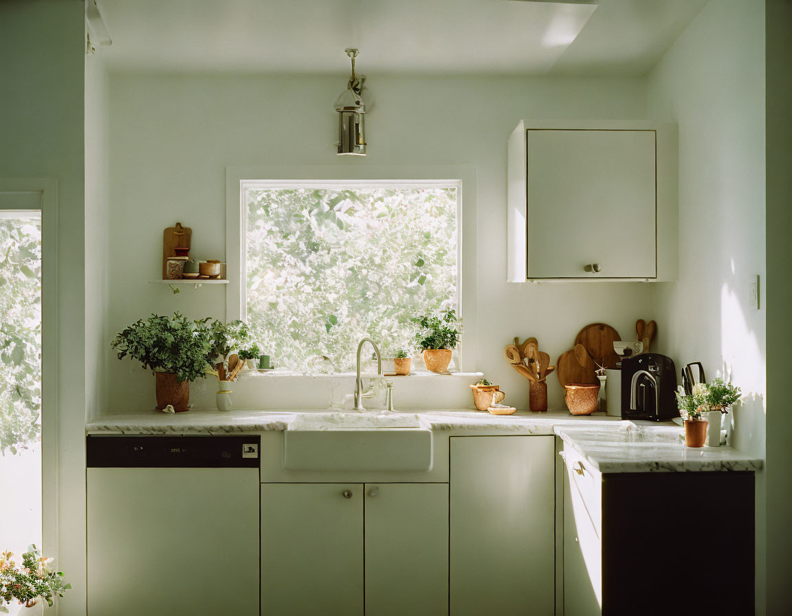 Sunlit Kitchen with Farm-Style Sink & Marble Countertops