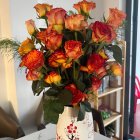 Fresh Pink Roses Bouquet in White Vase on Neutral Background