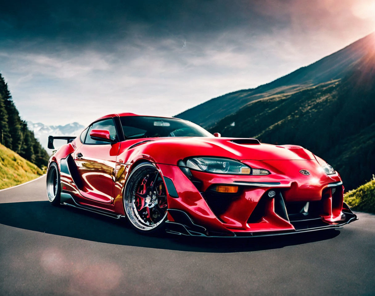 Custom Red Sports Car with Rear Wing on Mountain Road at Sunset