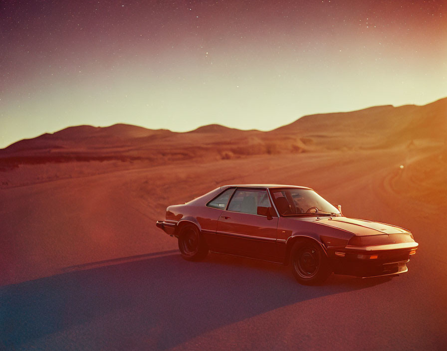 Vintage Car Parked on Desert Road at Dusk