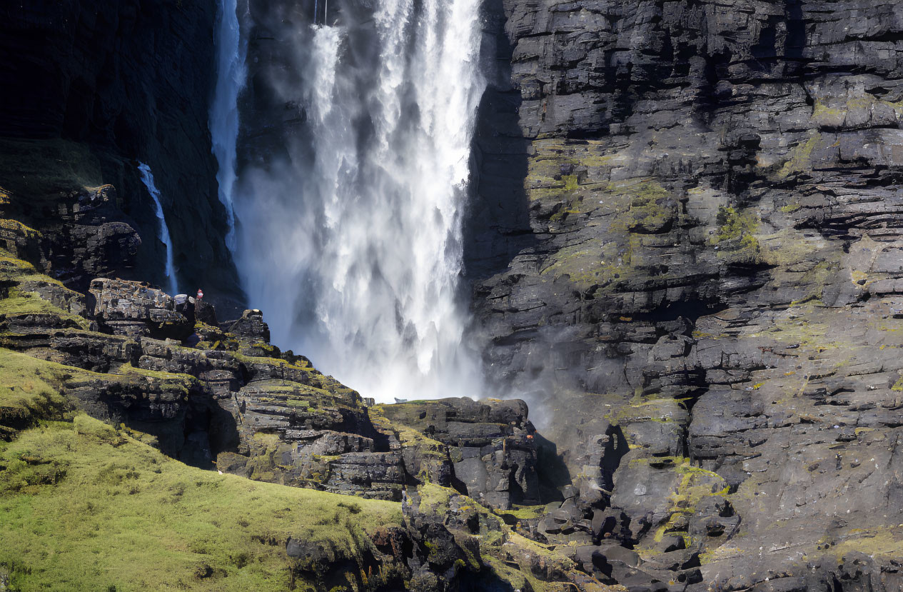 Majestic Waterfall Cascading Down Cliff, Person in Red Jacket Observing