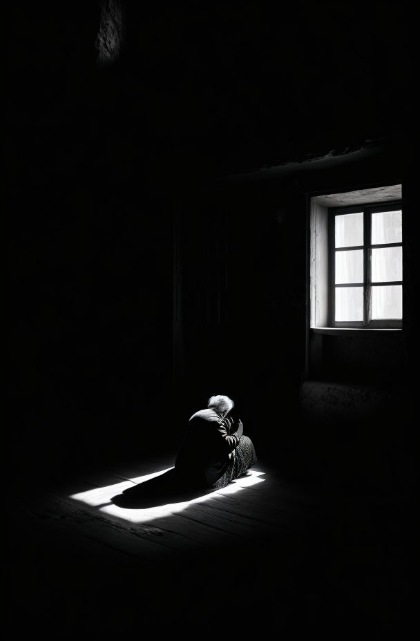 Crouched Person in Dark Room with Bright Light Square