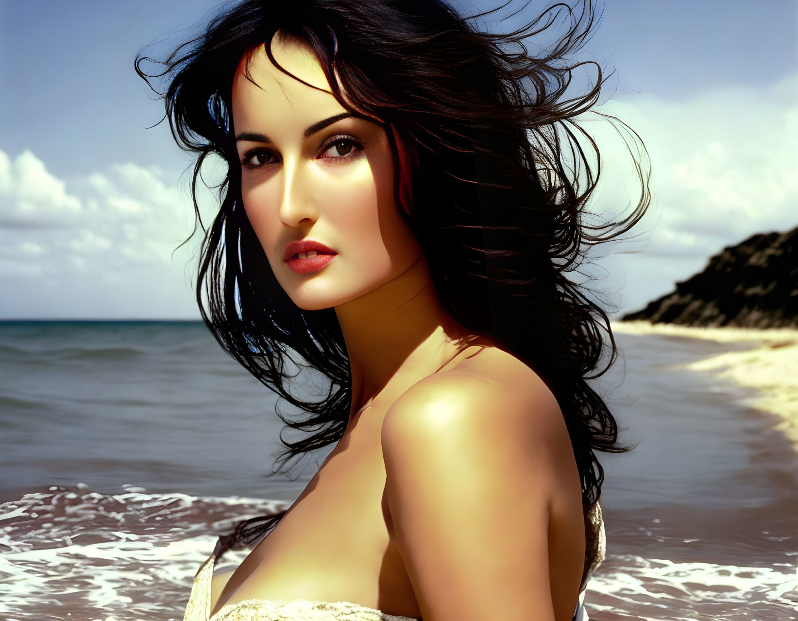 Dark-Haired Woman Poses on Beach with Windswept Hair