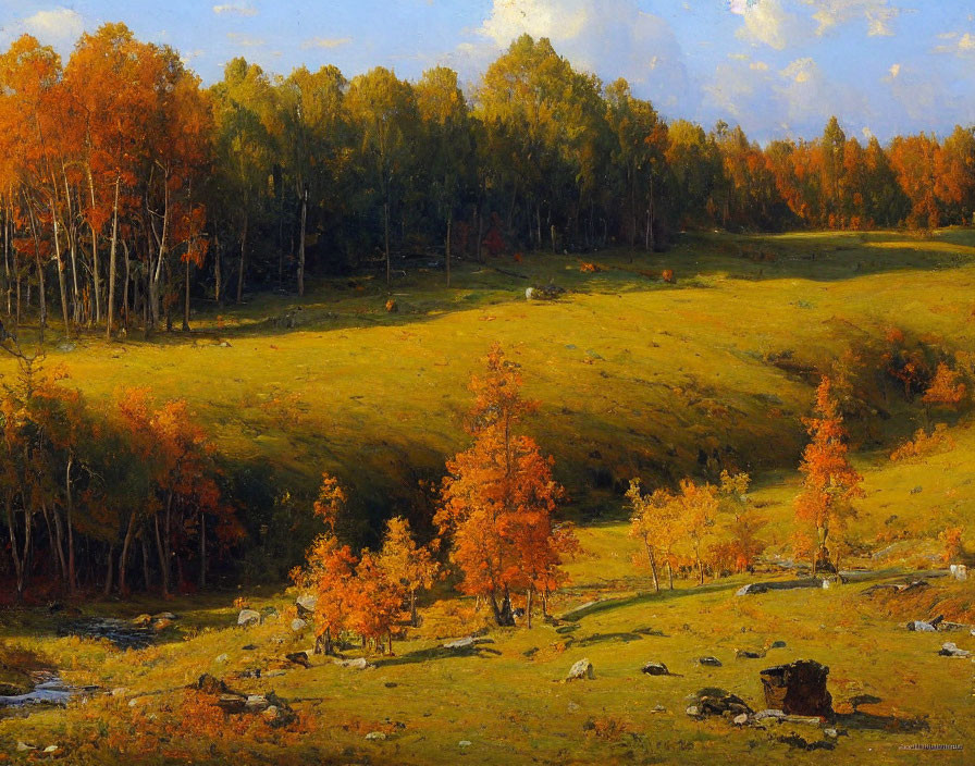 Tranquil meadow scene with autumn trees under blue sky