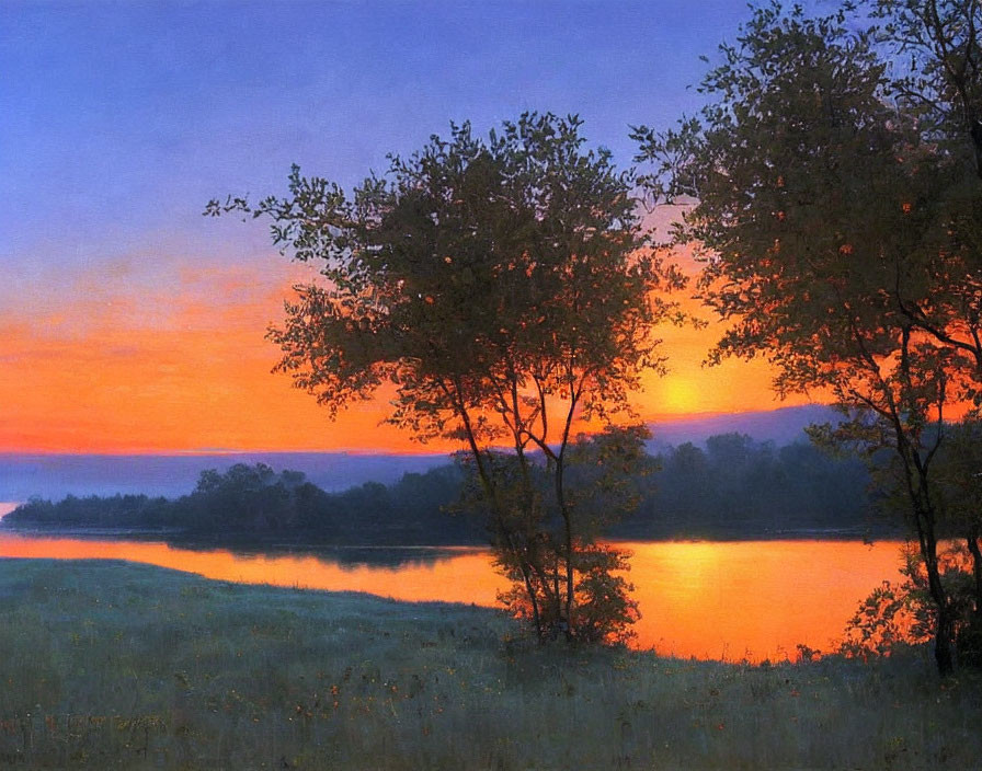 Tranquil river sunset with orange sky and silhouetted trees