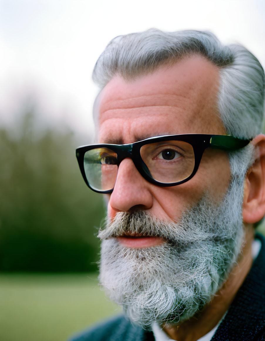 Senior Man with Thick White Beard and Glasses in Close-up Portrait