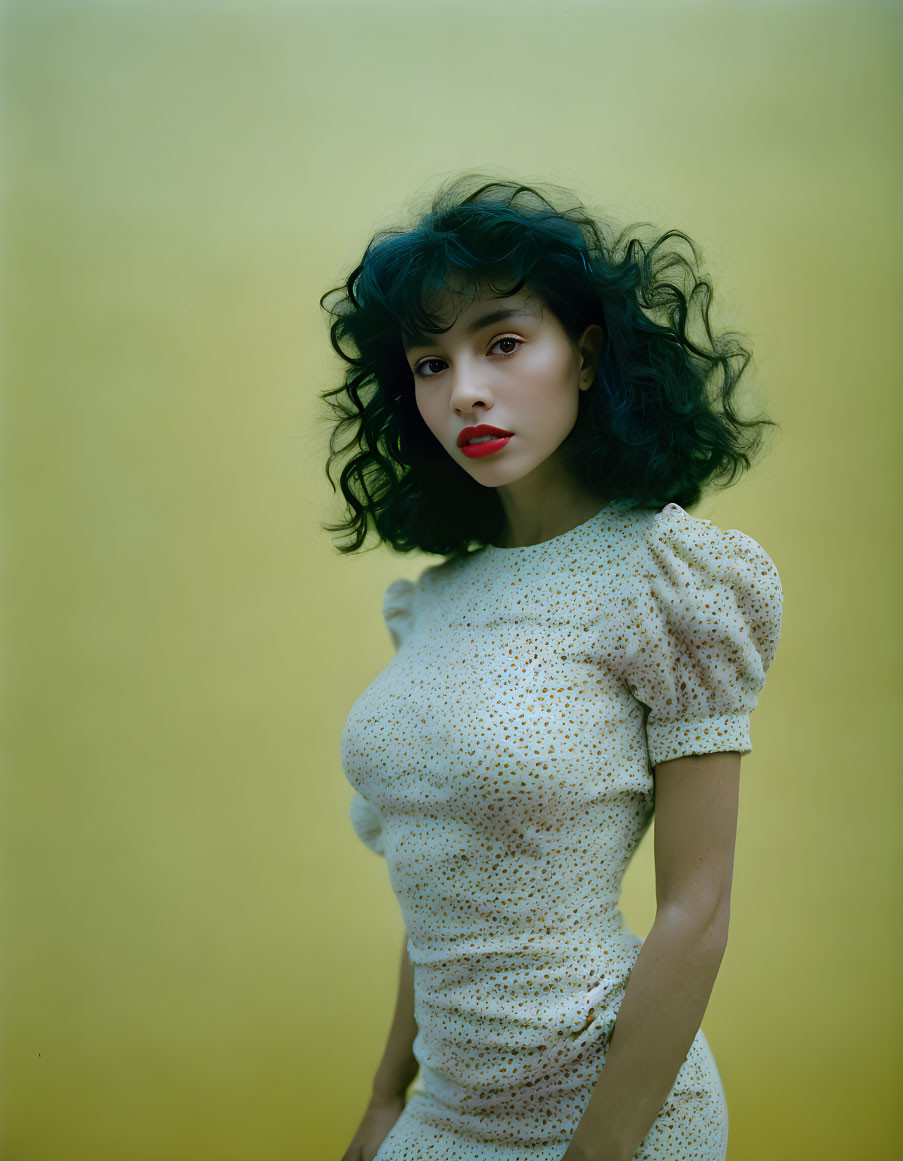 Woman in White Polka-Dotted Dress with Red Lipstick on Yellow Background